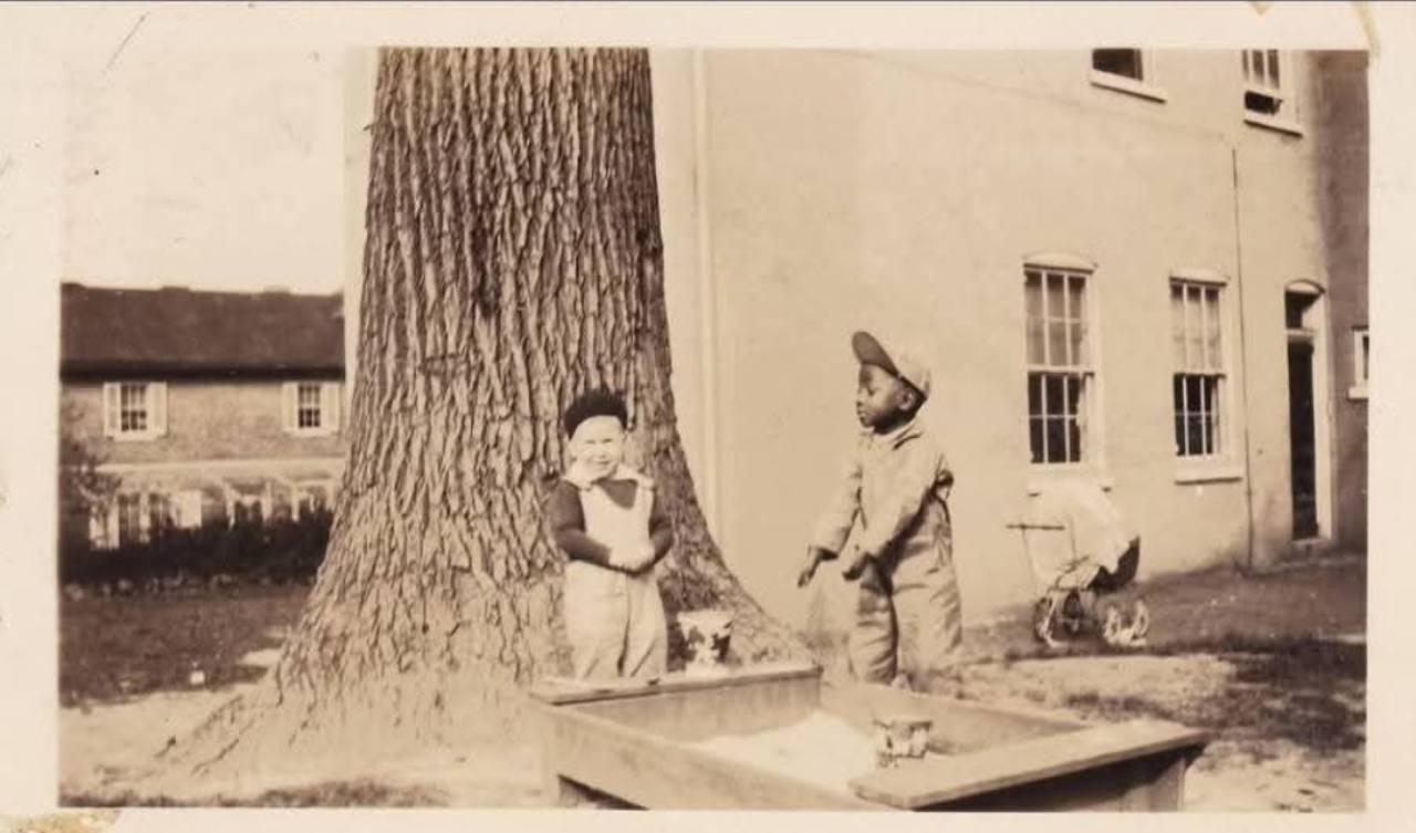 The garden. Thomas Sylvester Allen with a member of the du Pont family. Identification supplied by Johnny Thunder Allen.